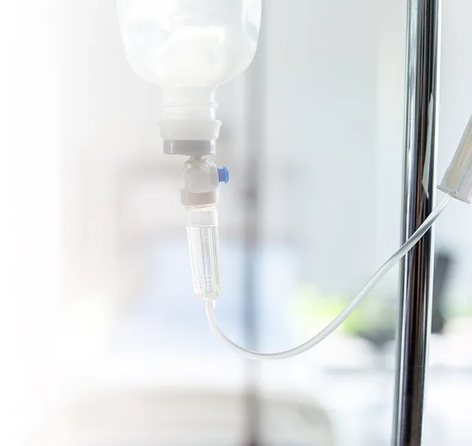 IV infusion bag and tubing in a bright clinical treatment room