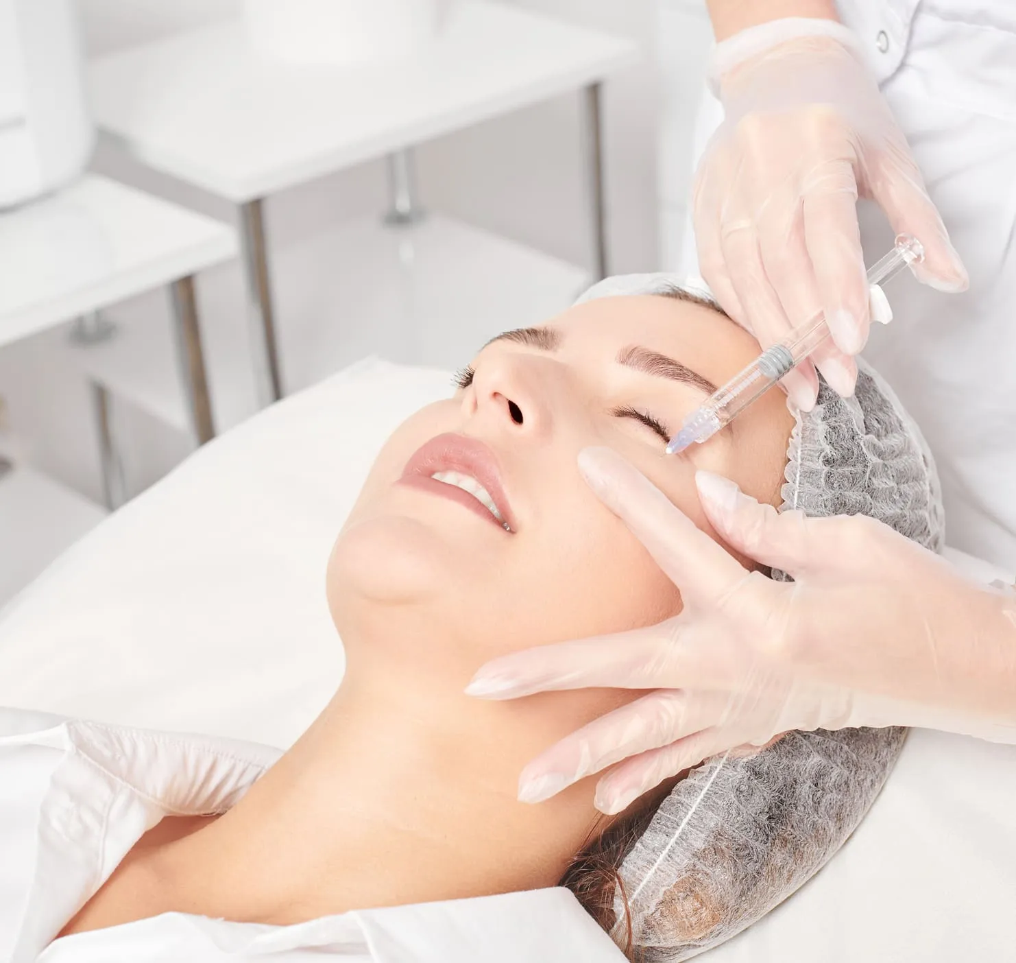Close-up of woman receiving dermal filler treatment in modern aesthetics clinic