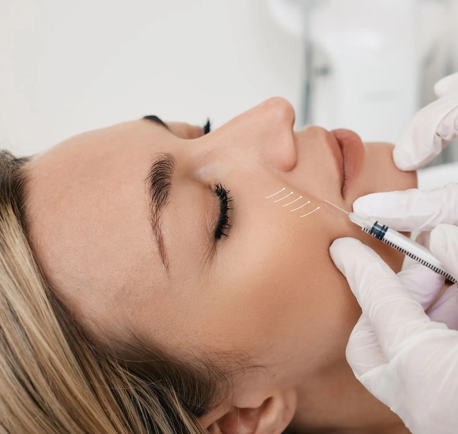 Close-up of professional administering a neurotoxin injection for wrinkle relaxer treatment