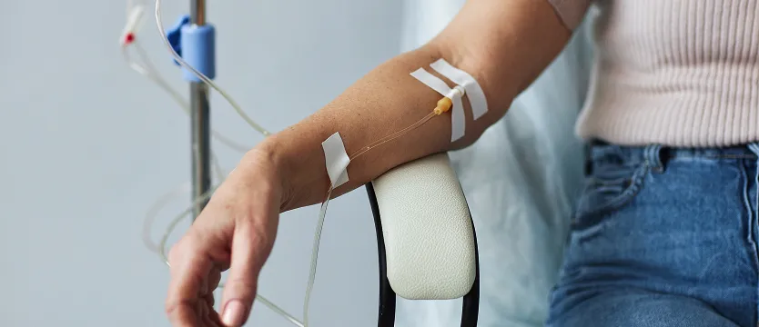 IV drip chamber with citrus fruits in a bright clinical wellness setting