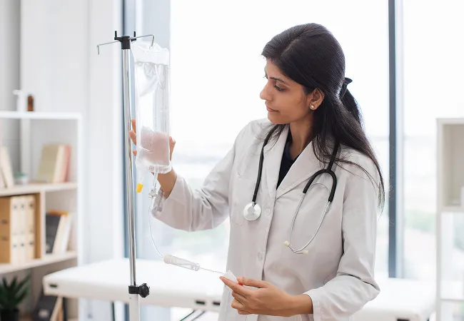 Young woman in white robe receiving IV therapy in modern wellness clinic with spa-like ambiance