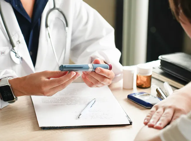 Medical provider discussing personalized weight loss treatment plan with patient