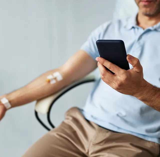 Patient receiving IV infusion therapy in a comfortable clinical treatment chair