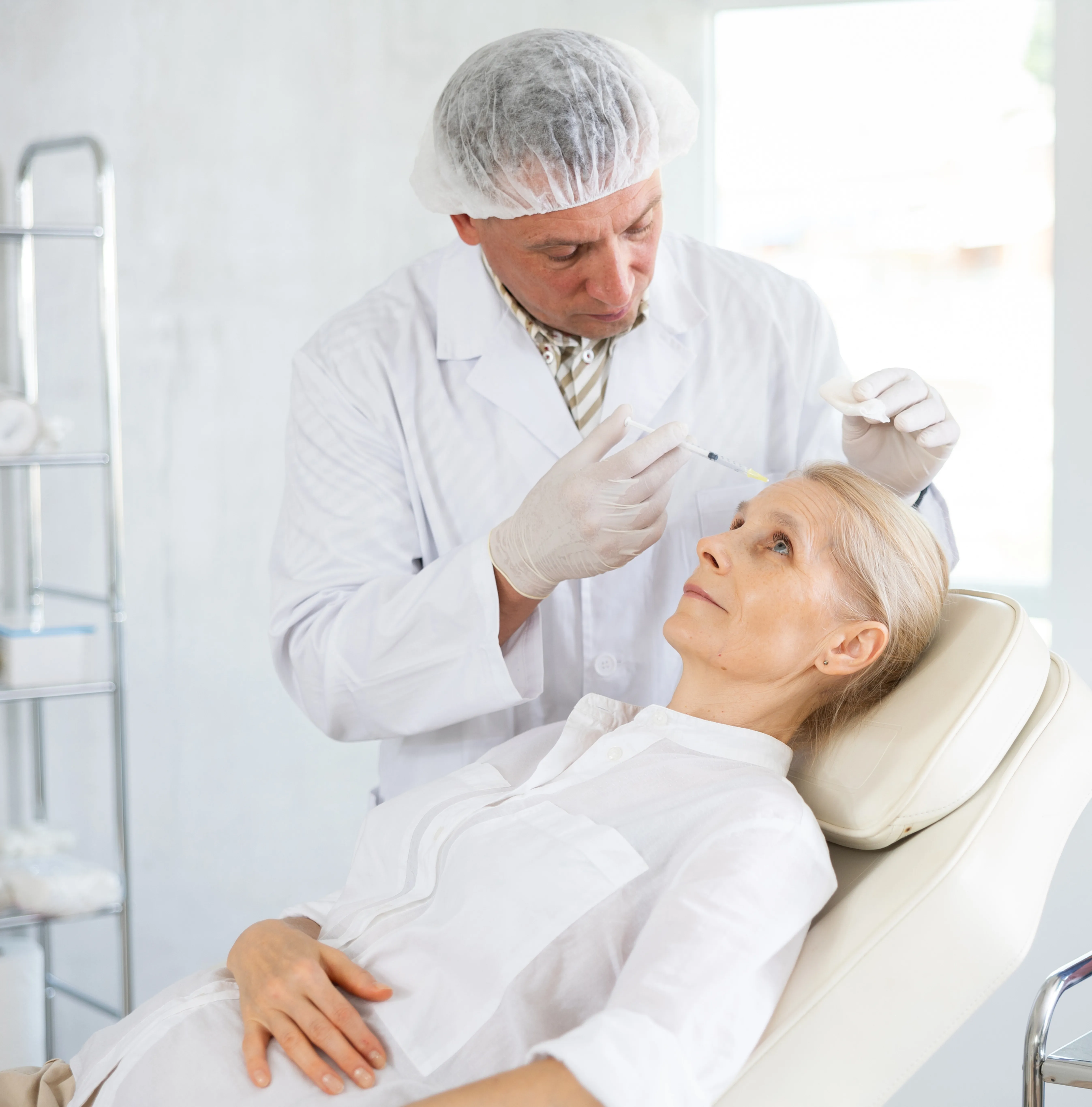Close-up of professional administering a neurotoxin injection for wrinkle relaxer treatment