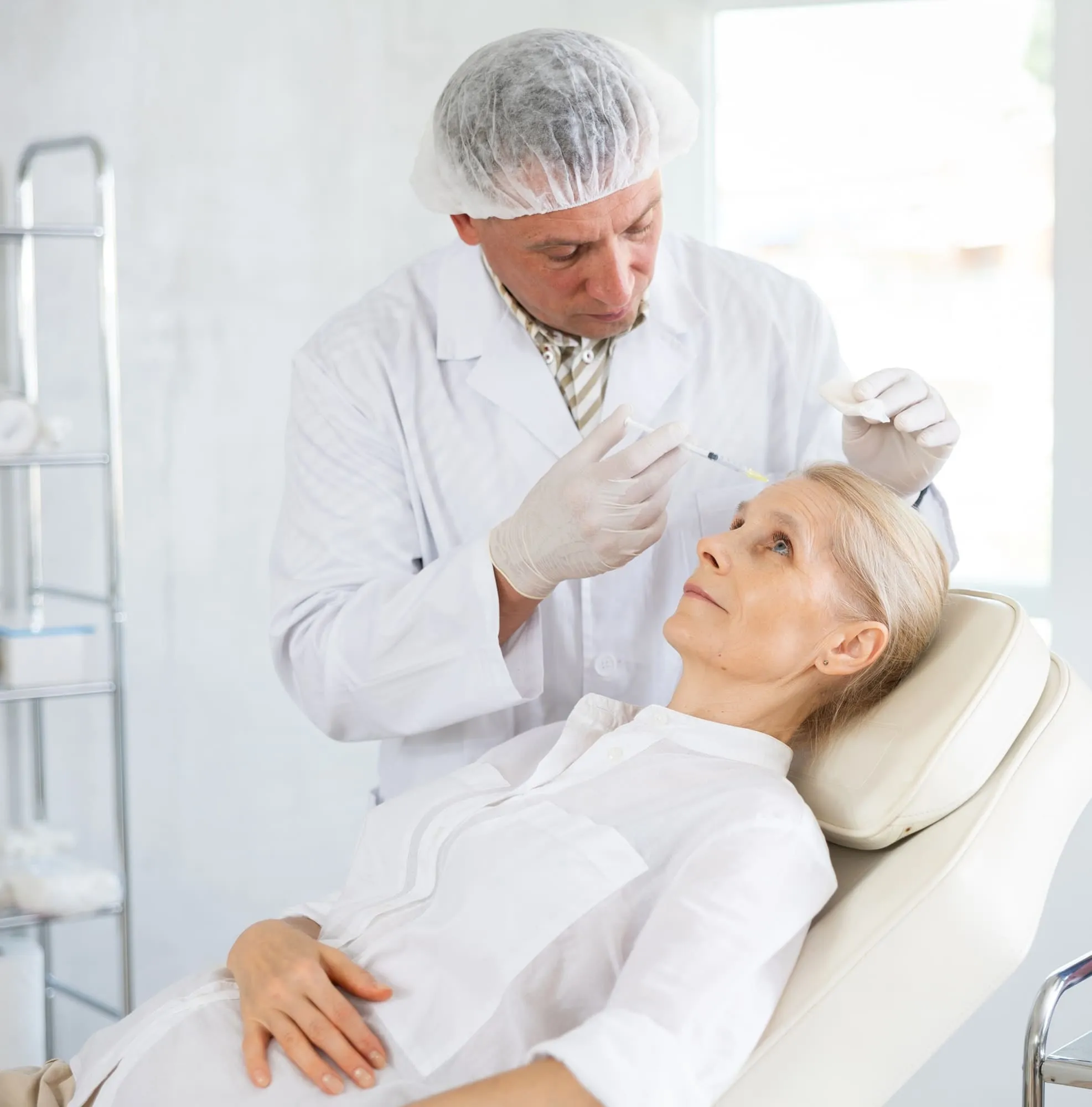 Close-up of professional administering a neurotoxin injection for wrinkle relaxer treatment