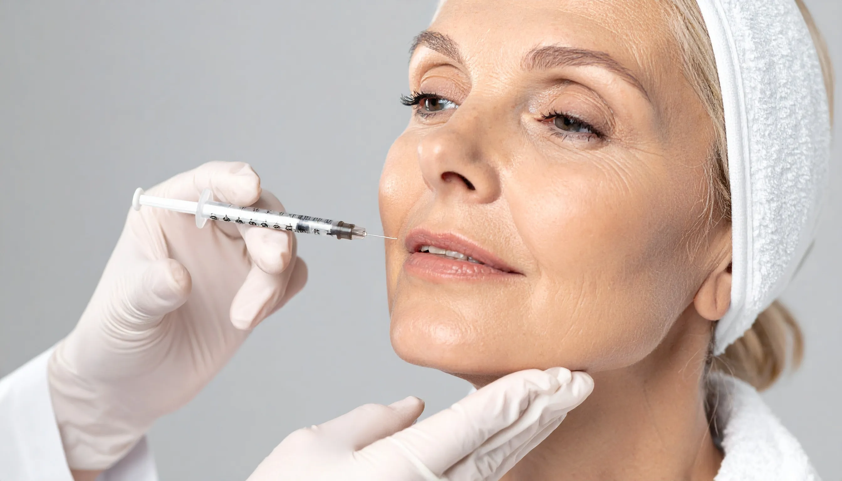 woman receiving wrinkle relaxers injection
